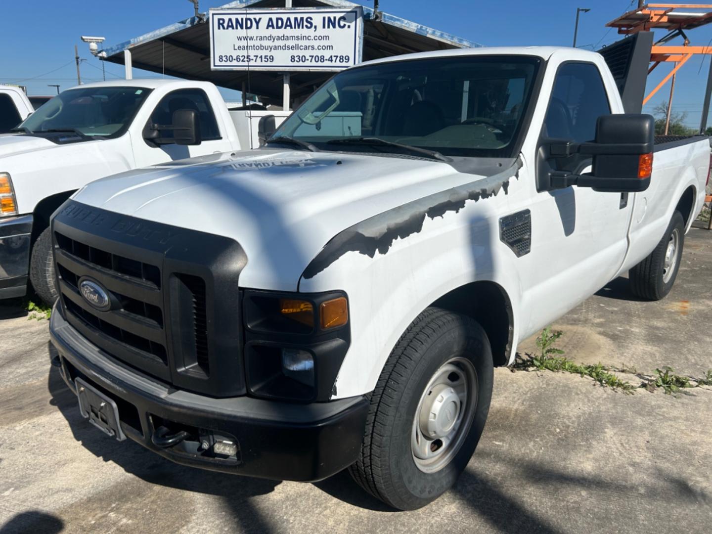 2010 White Ford F-250 SD XL 2WD (1FTNF2A56AE) with an 5.4L V8 SOHC 16V engine, located at 1687 Business 35 S, New Braunfels, TX, 78130, (830) 625-7159, 29.655487, -98.051491 - Photo#0